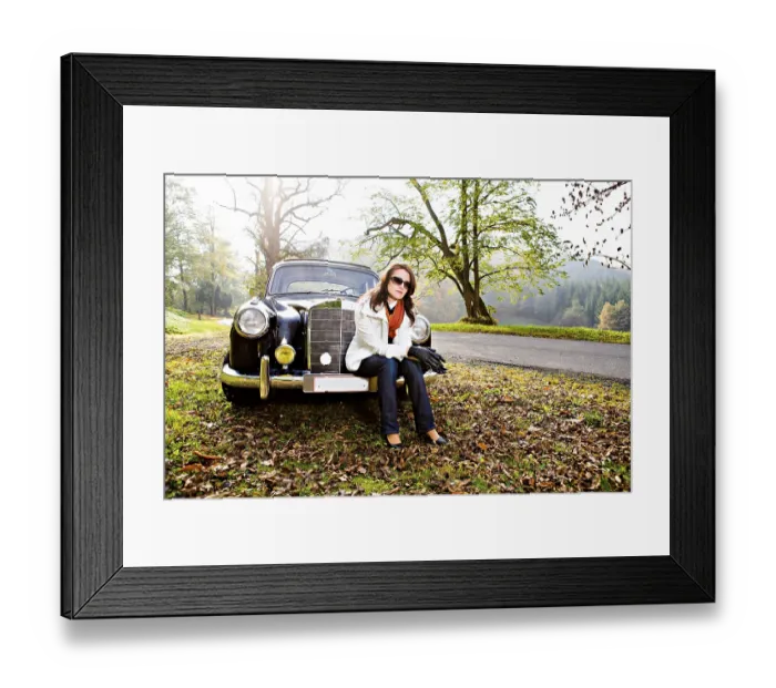 Framed Print : Young woman in front of a post-war classic car Framed Print : Young woman in front of a post-war classic car