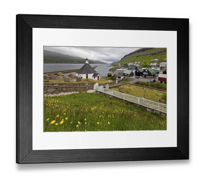 Framed Print : The small village Haldarsvik with the octagonal church and view of the Atlantic Ocean Framed Print : The small village Haldarsvik with the octagonal church and view of the Atlantic Ocean
