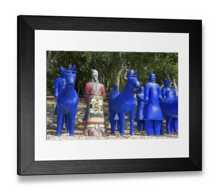 Framed Print : Blue terracotta soldiers and horse statues with a painted soldier in a forest