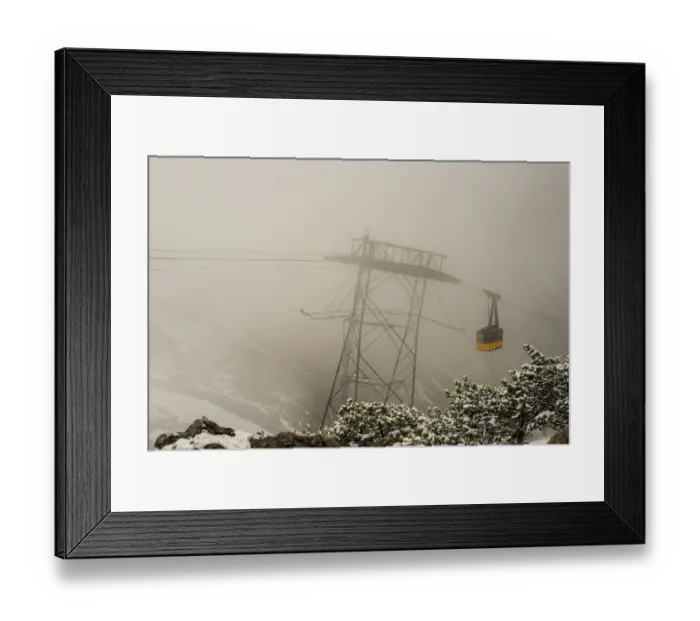 Framed Print : Cable car technicians working in bad weather conditions