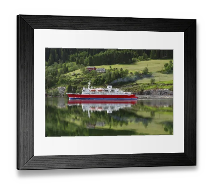 Framed Print : A cruise ship is reflected on a calm fjord in front of a green landscape