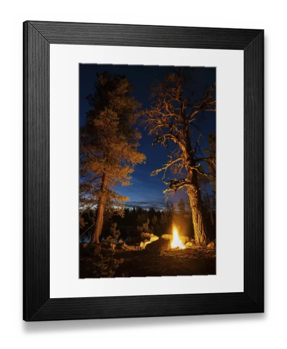 Framed Print : Man in the evening at a bivouac with campfire