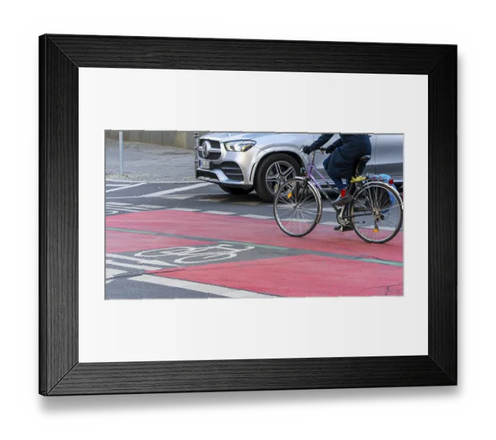 Framed Print : Red marked cycle path in the city centre