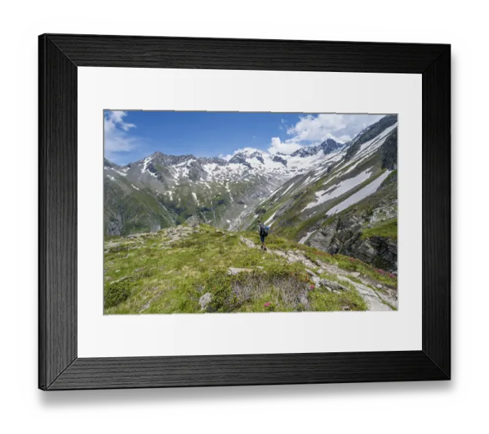 Framed Print : Mountaineer on hiking trail in picturesque mountain landscape