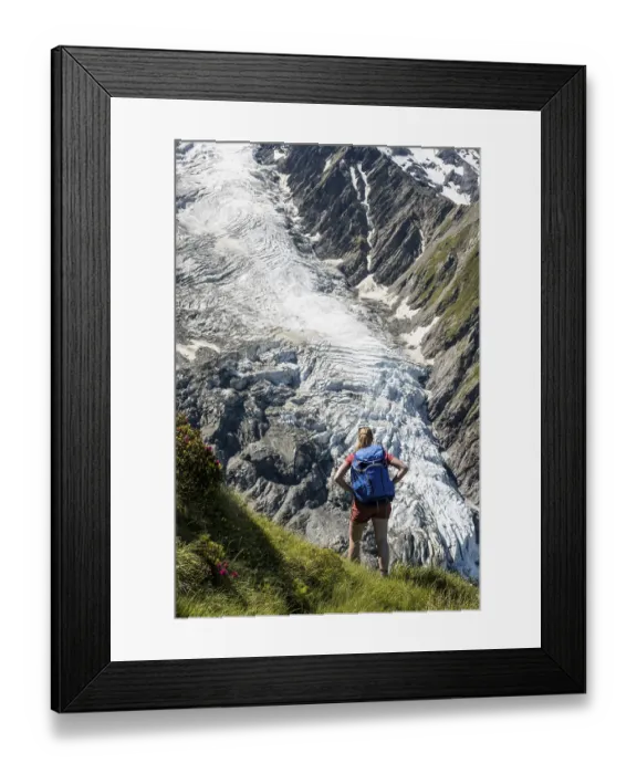 Framed Print : Hiker in front of glacier, hiking trail La Jonction