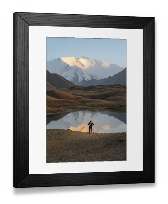 Framed Print : Hiker looking at mountain landscape