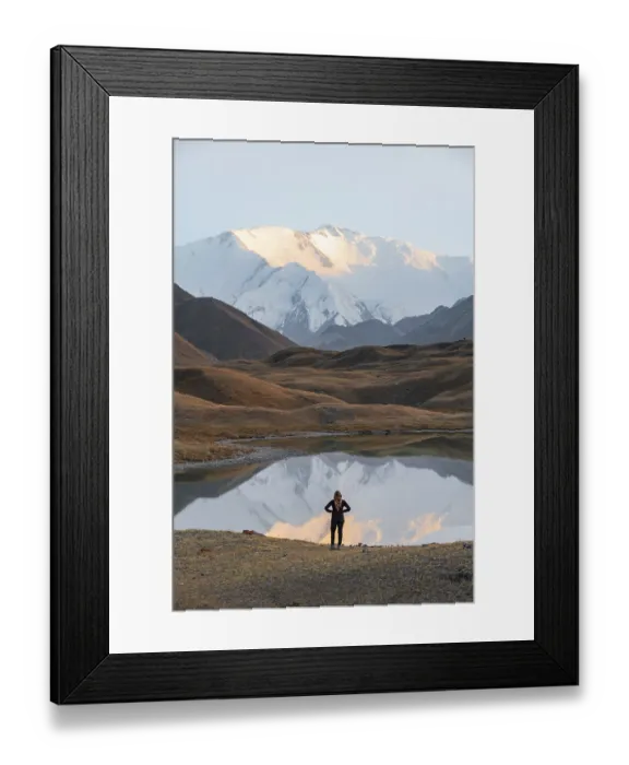 Framed Print : Hiker looking at mountain landscape