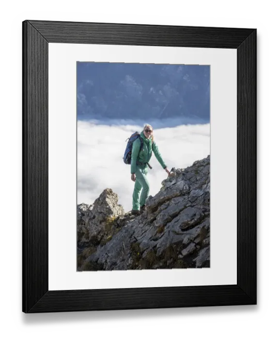 Framed Print : Hiker at Ettaler Manndl, view over mountain landscape and sea of clouds