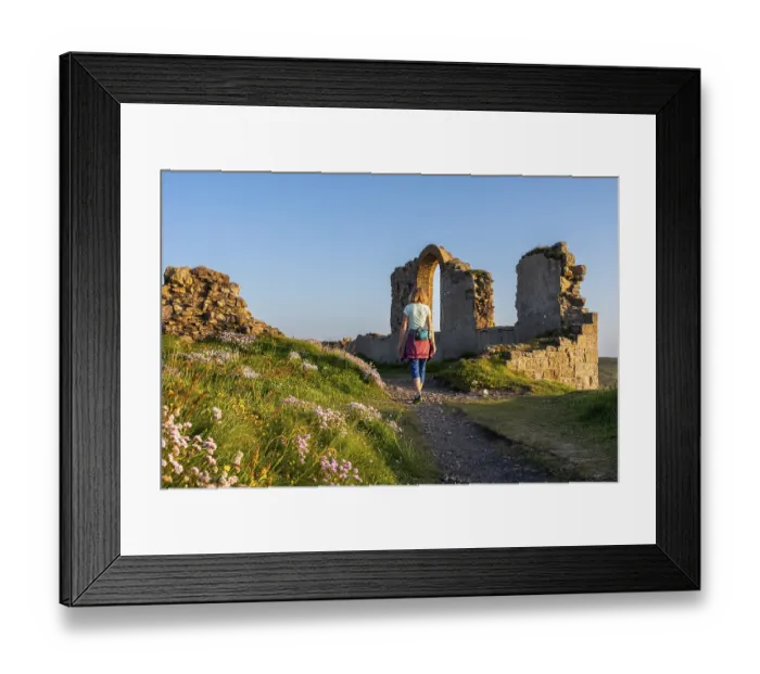 Framed Print : A hiker on a path in the ruins of Botallack Mine