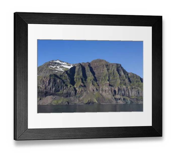 Framed Print : Rugged mountains and steep sea cliffs along the fjord Seyoisfjoerour
