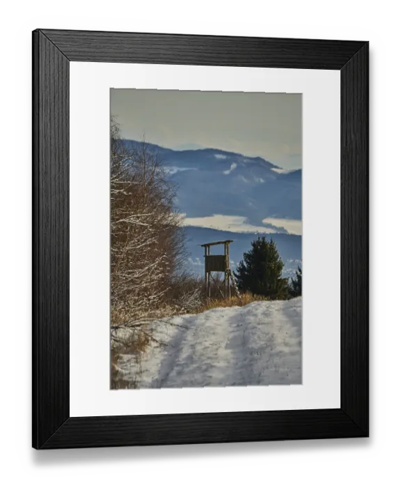 Framed Print : Hunters blind in a snowy landscape next to the forest