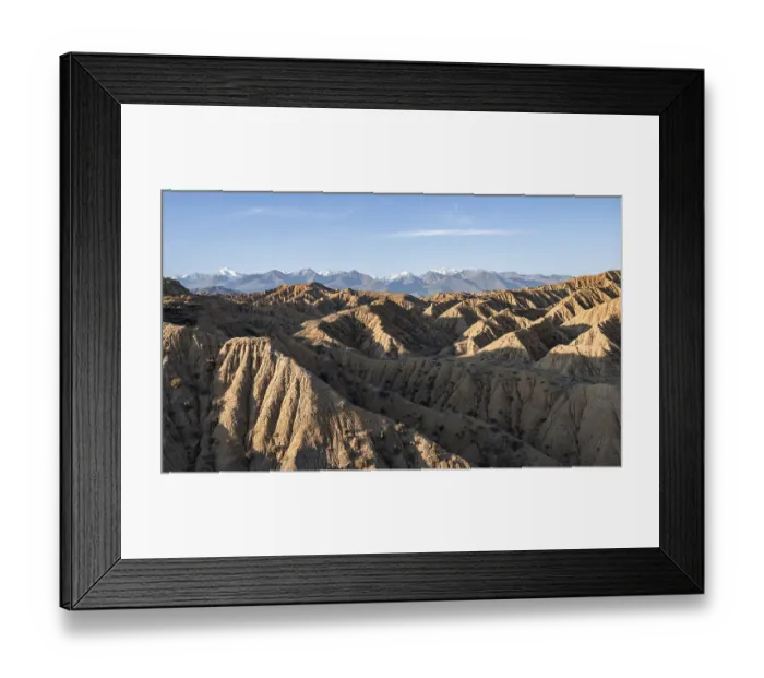 Framed Print : Sunrise over canyons, Tian Shan mountains in the background