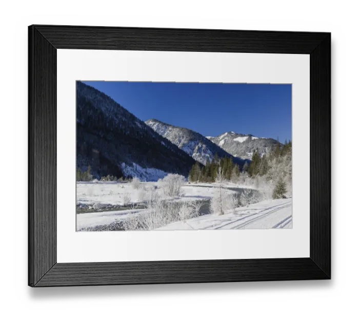 Framed Print : The Riss creek flowing fast through the snow covered Eng valley
