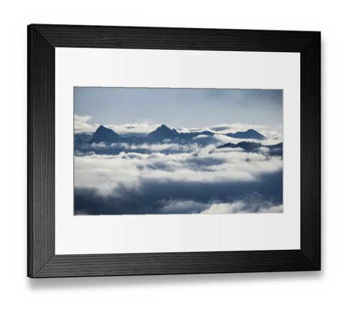 Framed Print : View of mountains between clouds Framed Print : View of mountains between clouds