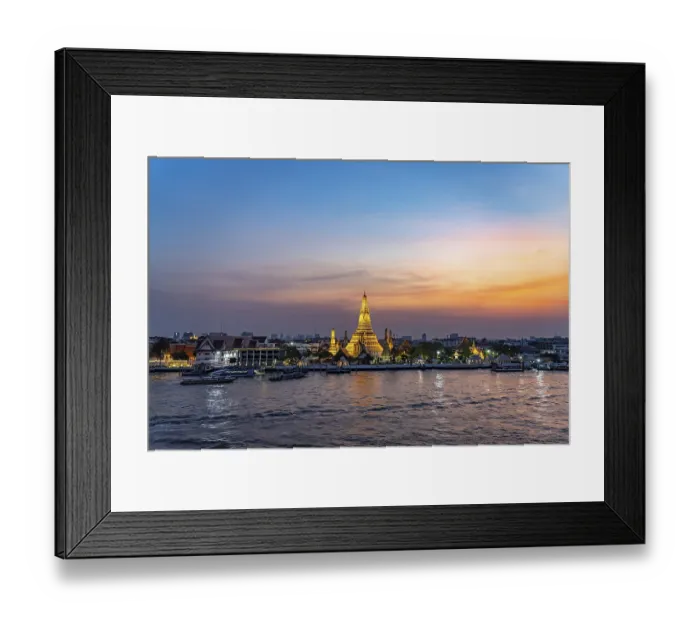 Framed Print : The Buddhist temple Wat Arun or Temple of Dawn and the Chao-Phraya River at dusk