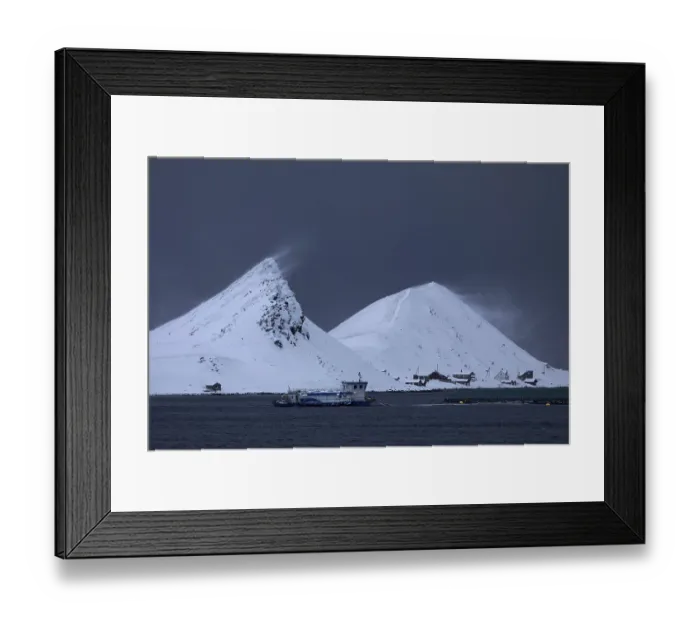 Framed Print : Windswept snow-capped mountains on the island of Mageroya