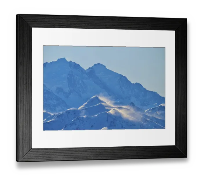 Framed Print : Snowy mountain peaks backlit with snow