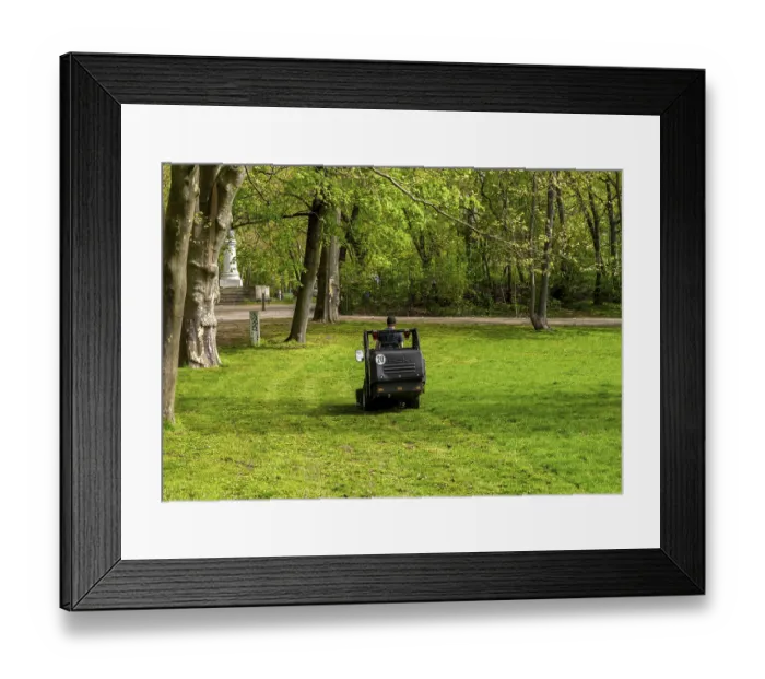 Framed Print : Mobile lawn mower, Gaertner im Park Framed Print : Mobile lawn mower, Gaertner im Park