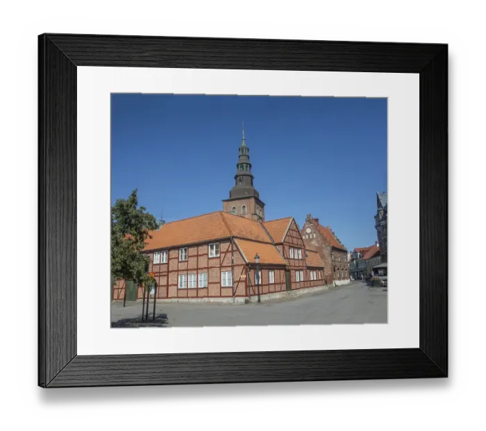 Framed Print : Old half-timbered building from the 18th century with St