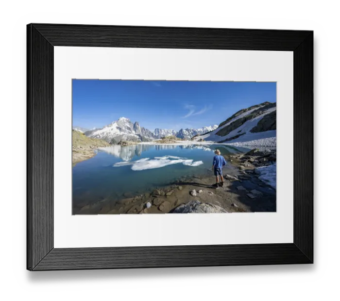 Framed Print : Mountaineer in front of mountain landscape with mountain lake