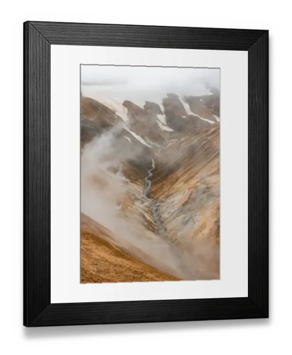 Framed Print : Steaming stream between colourful rhyolite mountains and snowfields Framed Print : Steaming stream between colourful rhyolite mountains and snowfields