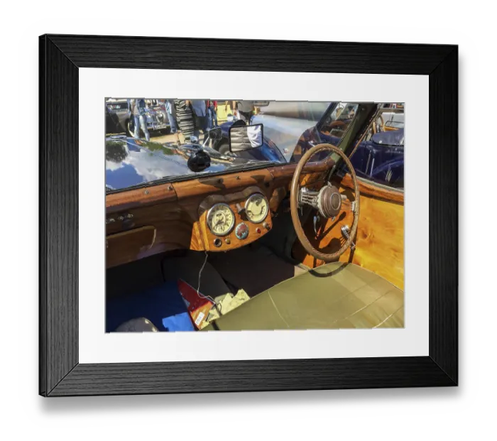 Framed Print : View on wooden dashboard with classic analogue round instruments of historic sports car convertible Triumph Roadster