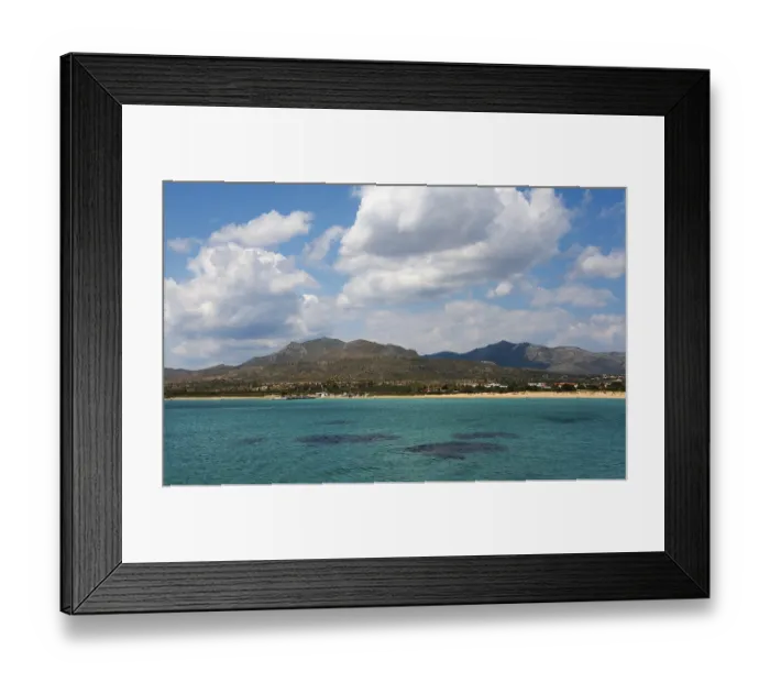 Framed Print : A wide view over the sea with mountains and clouds in the background Framed Print : A wide view over the sea with mountains and clouds in the background