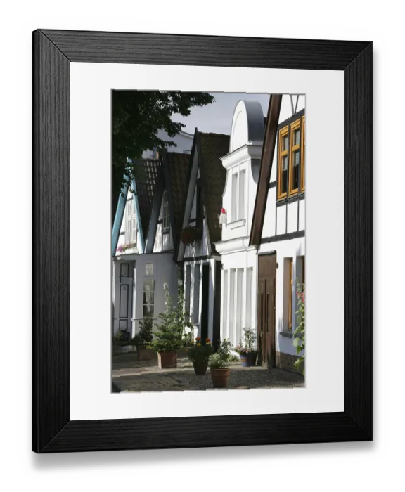 Framed Print : Residential street in the historic centre of the Baltic Sea resort town of Warnemuende Framed Print : Residential street in the historic centre of the Baltic Sea resort town of Warnemuende