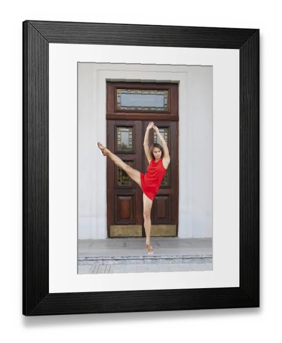 Framed Print : Full length portrait of pretty girl in short dress lifting her leg up