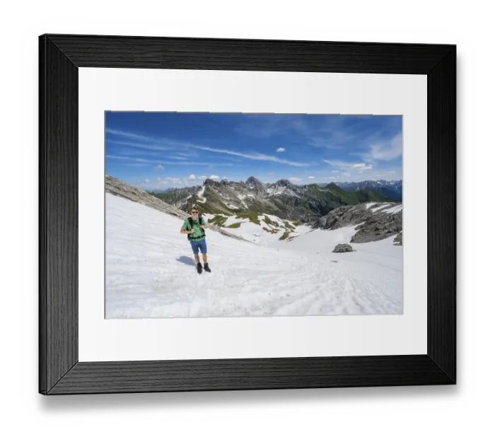 Framed Print : Hiker on a snow field, mountaineer on the hiking trail
