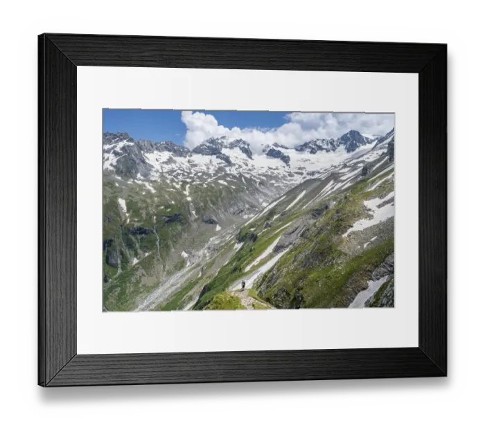 Framed Print : Mountaineer on hiking trail in picturesque mountain landscape