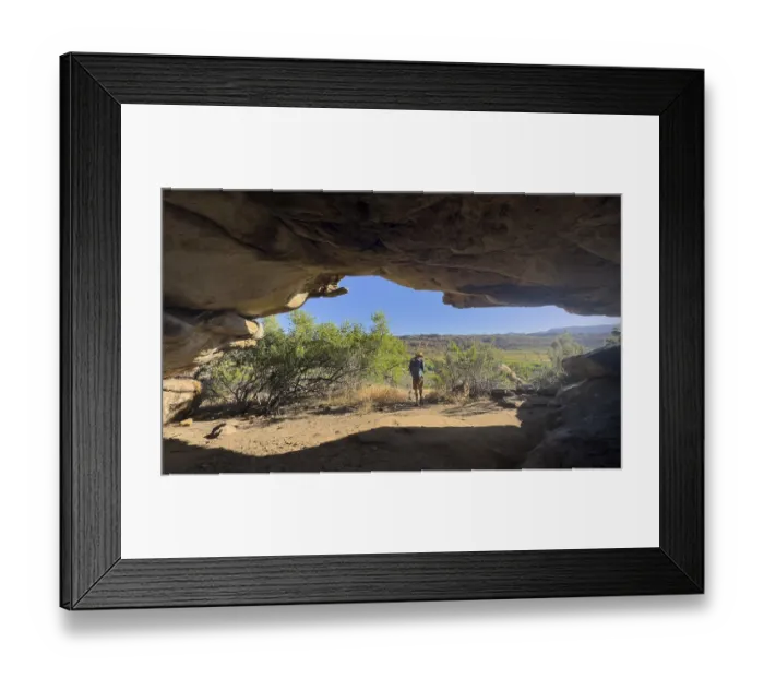 Framed Print : Hikers at the entrance to a cave Framed Print : Hikers at the entrance to a cave