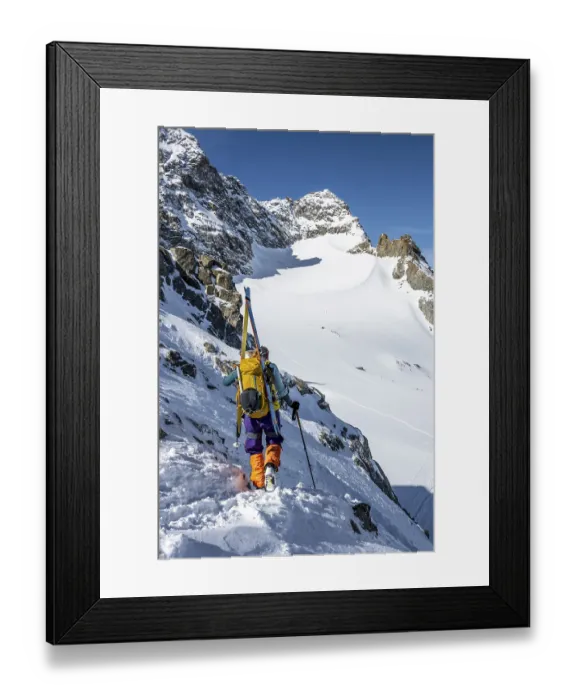 Framed Print : Mountaineer with skis at the fork Porta d'Es-cha