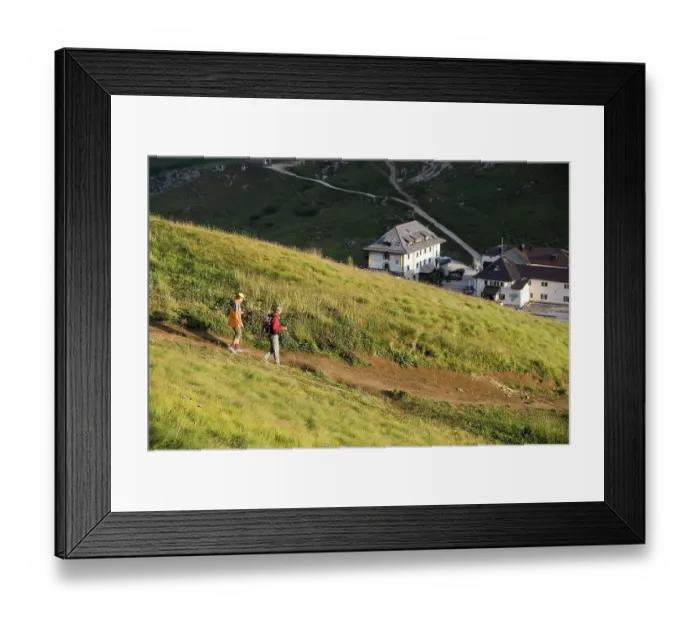 Framed Print : Hikers descending from the Sella massif to the Passo Pordoi in the evening Framed Print : Hikers descending from the Sella massif to the Passo Pordoi in the evening