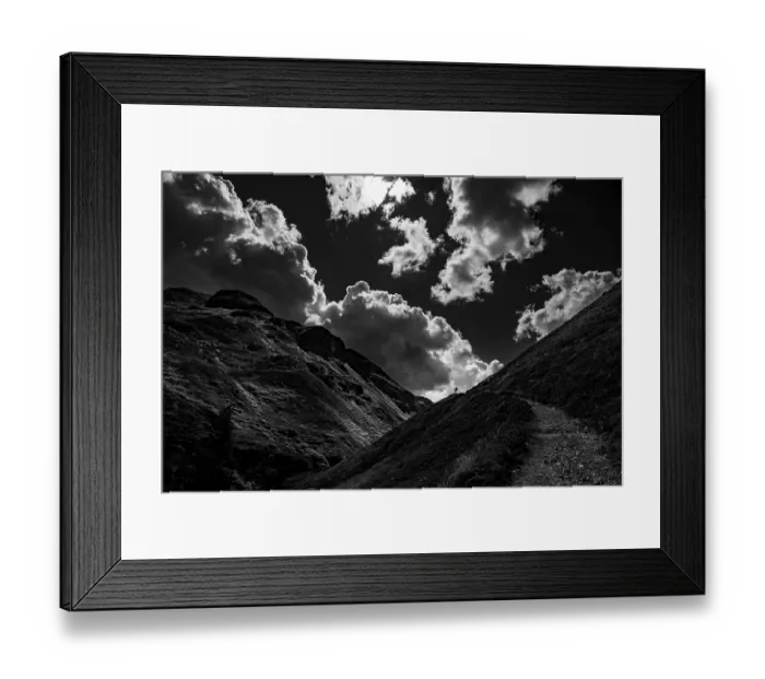Framed Print : Mountain path with climber in Val Belver with cloudy sky Framed Print : Mountain path with climber in Val Belver with cloudy sky