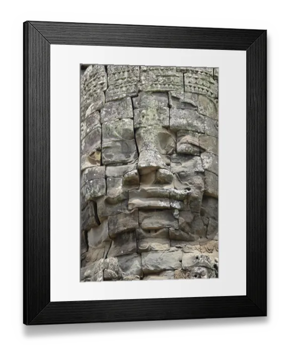 Framed Print : Huge stone-carved faces of the Bodhisattva Lokeshvara or Avalokiteshvara