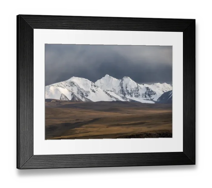 Framed Print : Glaciated and snow-capped mountains in the evening light