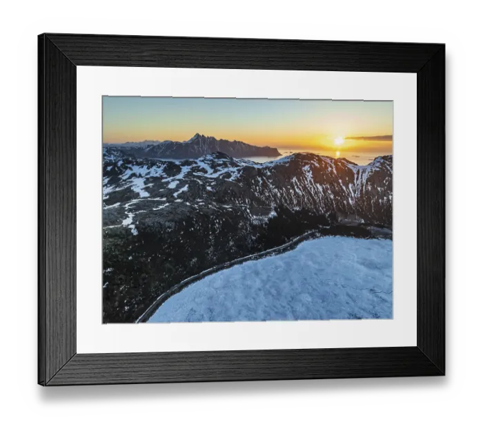 Framed Print : Aerial view of icy lake in front of steep mountains
