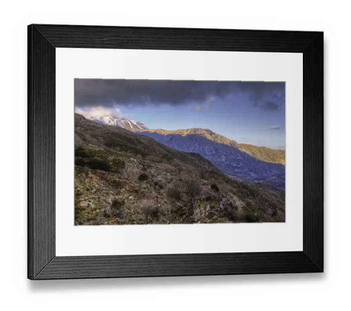 Framed Print : Stony mountain landscape with snow-covered peaks under a slightly cloudy sky Framed Print : Stony mountain landscape with snow-covered peaks under a slightly cloudy sky