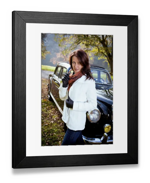 Framed Print : Young woman in front of a vintage car in a park in autumn Framed Print : Young woman in front of a vintage car in a park in autumn