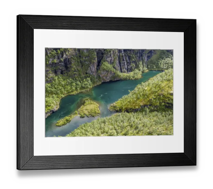Framed Print : Aerial view of an island in a turquoise colored river surrounded by birch forest
