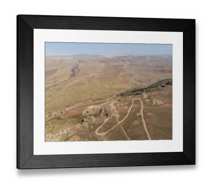 Framed Print : Moldo-Ashuu Pass, serpentines, car on road between yellow hills Framed Print : Moldo-Ashuu Pass, serpentines, car on road between yellow hills