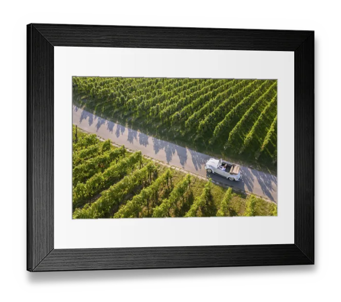 Framed Print : UAV recording, businessman in a vintage car