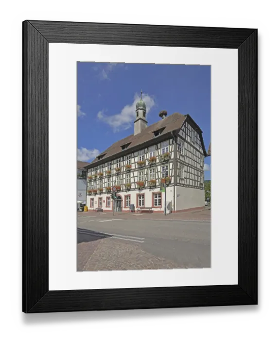 Framed Print : Half-timbered house and town hall with spire