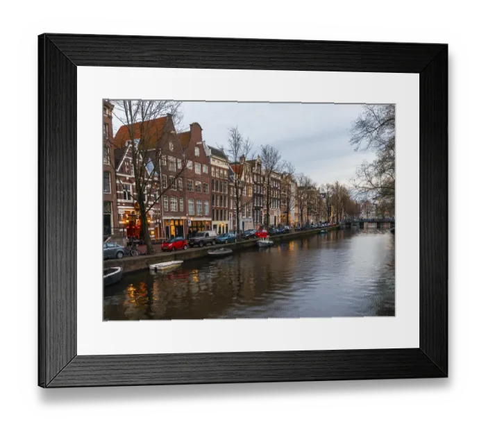 Framed Print : Historic row of houses on a canal at dusk