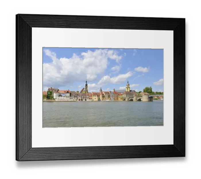 Framed Print : Main river with the Catholic parish church of St