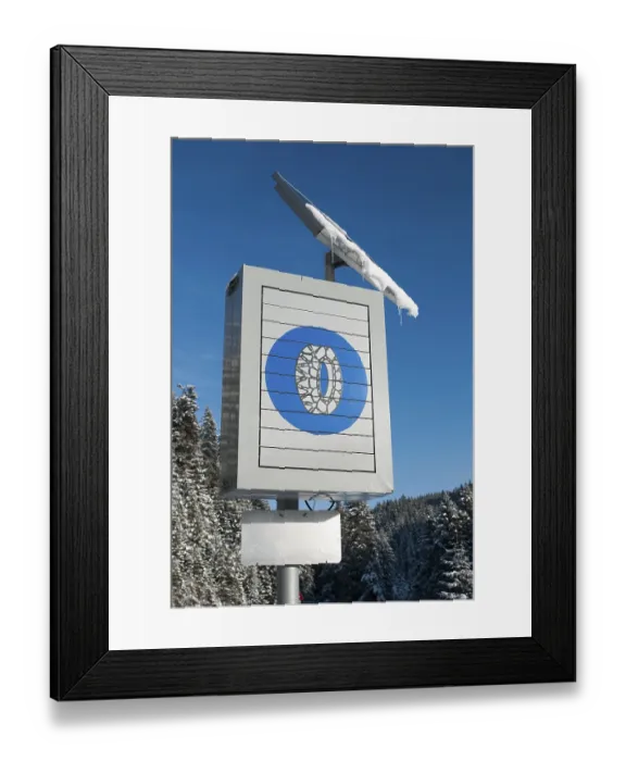 Framed Print : Solar-powered traffic sign indicating the use of snow chains