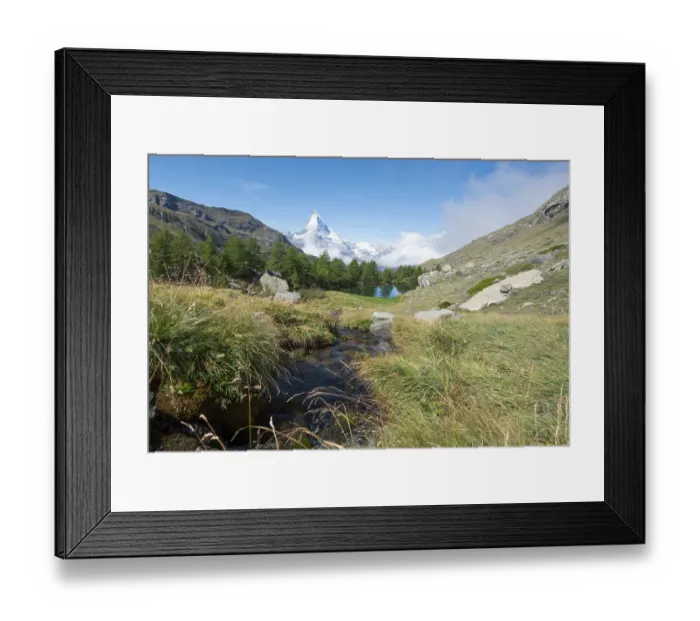 Framed Print : Snow-covered Matterhorn, mountain stream flows into Lake Grindij