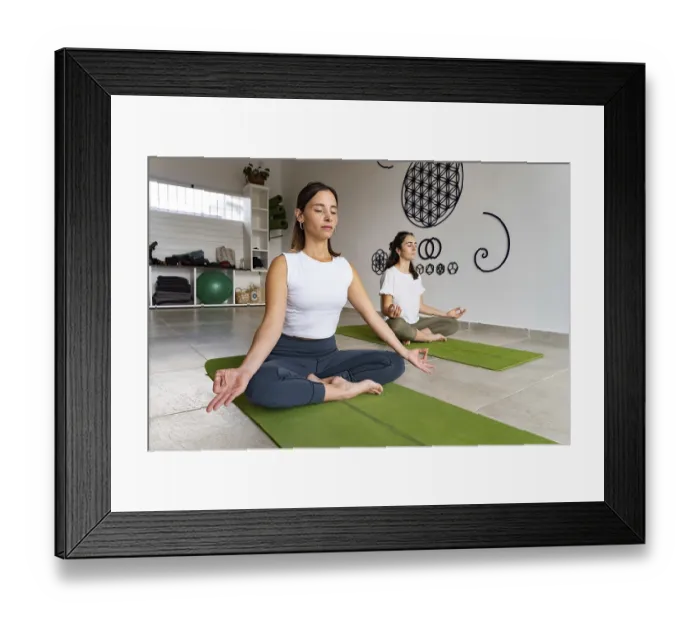 Framed Print : Women meditating in a yoga room on a green yoga mat with their eyes closed in a luminous environment Framed Print : Women meditating in a yoga room on a green yoga mat with their eyes closed in a luminous environment