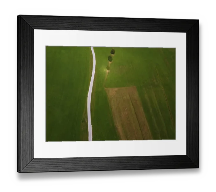 Framed Print : Drone shot, agricultural landscape with country road from above
